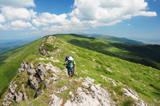 Hiker on summer mountain path inCentral Balkan national park, Bulgaria