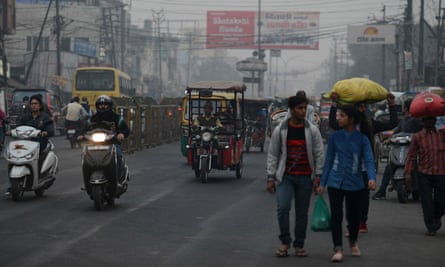Traffic moves through a smoggy area of the northern Indian city of Moradabad