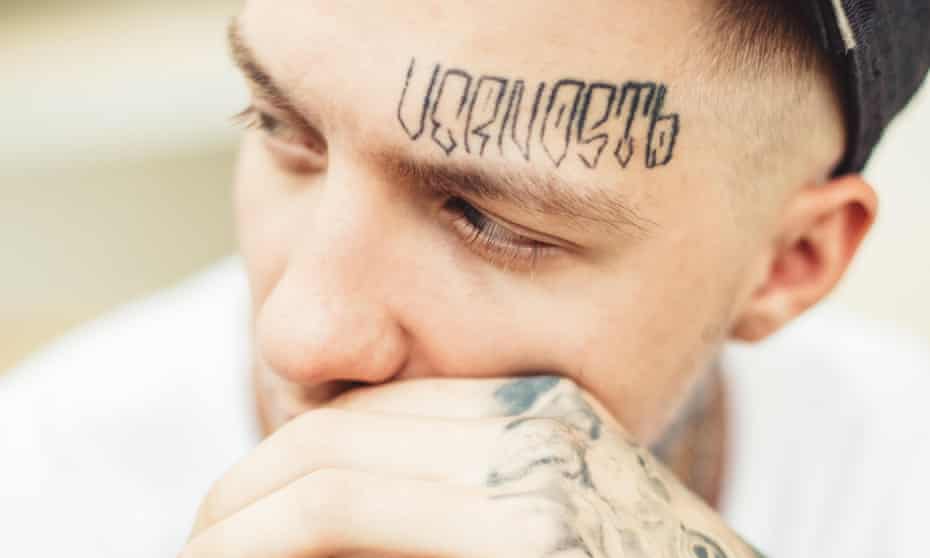 Making a statement … a man with a facial tattoo.