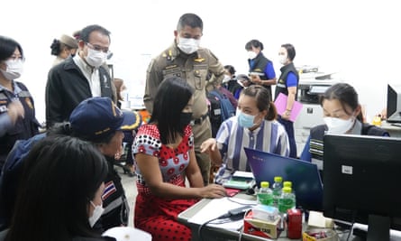 police and civil servants ask questions at VK garment factory in Mae Sot