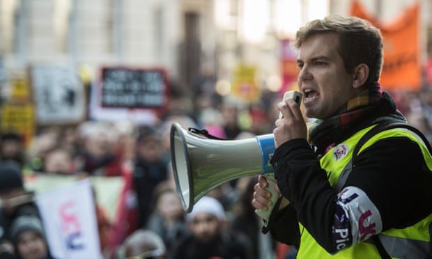 A UCU representative addresses a protest outside the University College London HQ on 4 December 2019.