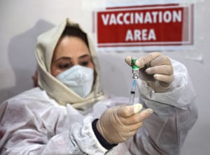 A nurse prepares to inject a dose of Covid vaccine in Srinagar, the summer capital of Indian Kashmir.