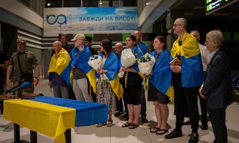 Nariman Dzhelyal, second right, deputy head of the Mejlis of the Crimean Tatar People stands among with other prisoners who have been recently released in Kyiv airport, Ukraine, Saturday, June 29, 2024