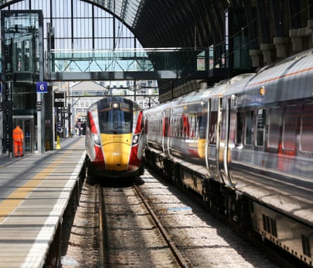 An LNER train pulls into King’s Cross station in London, with another train at the next platform