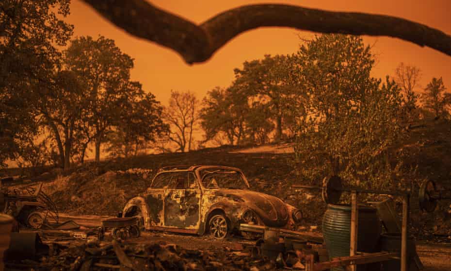 A Volkswagen Beetle scorched by the Carr Fire rests at a residence in Redding, California, Friday, July 27, 2018. 