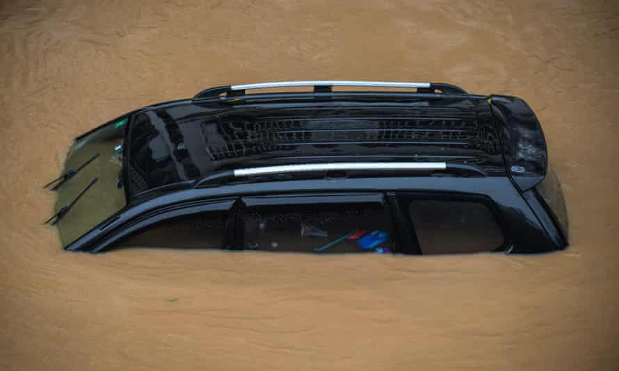 A car soaked in the waterlogged road in Shaoguan, Guangdong province.