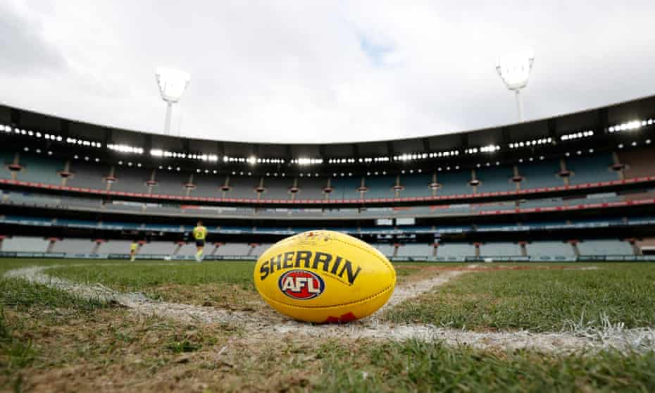 An AFL football at a sporting ground