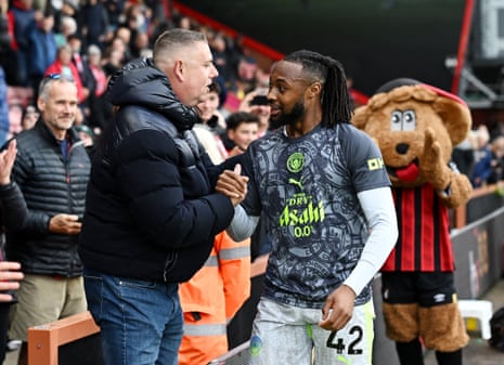 Manchester City's Antoine Semenyo speaks to an Bournemouth fan during the warm-up.