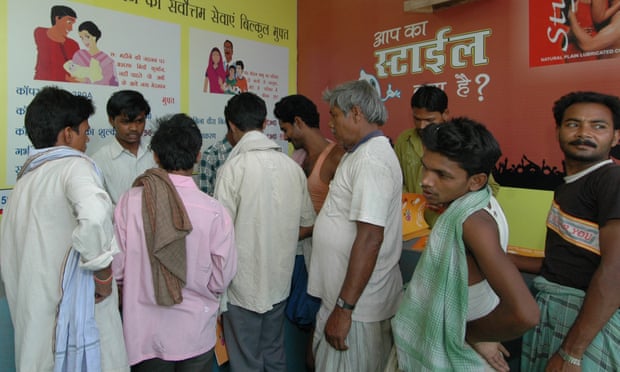 Men queue at a family planning clinic in India