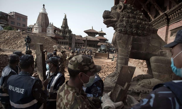 Nepalese soldiers line up to clear rubble of temples at Patan’s Durbar Square.