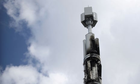 A telecommunications mast damaged by fire is seen in Birmingham.