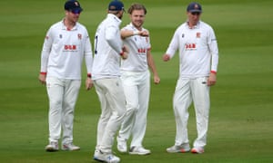 Essex’s Sam Cook celebrates with teammates after taking the wicket of Somerset’s Tom Lammonby.