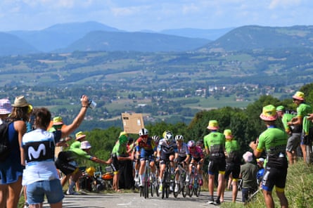 Spectators cheer Shirin Van Anrooij of Team Lidl - Trek and Mareille Meijering of Team Movistar as they lead the breakaway climbing the Cote de Saint-Franc (626m) on stage 7.