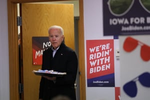 Joe Biden greets volunteers at state campaign headquarters in Des Moines, Iowa, on 13 January.