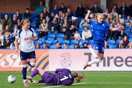Tottenham Hotspur goalkeeper Lize Kop makes a save at the feet of Chelsea’s Aggie Beever-Jones