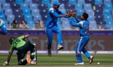 India’s Axar Patel celebrates with Kuldeep Yadav after running out Pakistan’s Imam-ul-Haq.