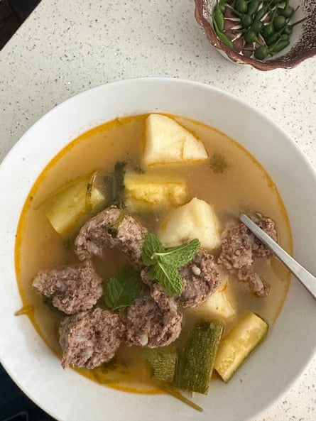 a bowel of food with large chucks of vegetables and meat
