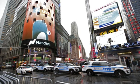 A row of New York City police cars parked along a street in Times Square ahead of New Year’s Eve.