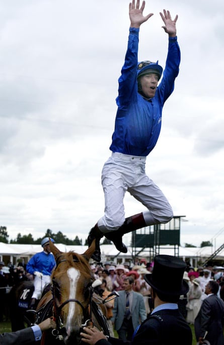 Frankie Dettori, winner of the 2004 Ascot Gold Cup, leaps from Papineau.