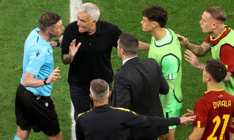 Roma manager Jose Mourinho confronts Fourth Official Michael Oliver after referee Anthony Taylor (not pictured) awards a penalty to Sevilla FC which is later overturned following a VAR review.