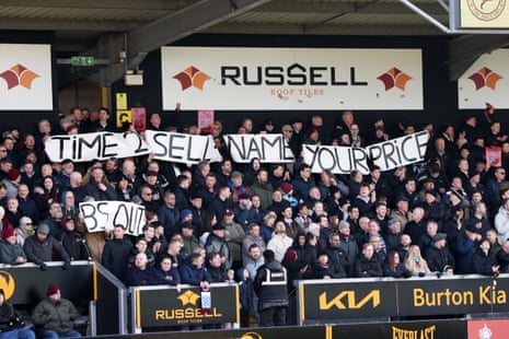 Fans of West Ham United display a banner in the stands which reads "Time to sell. Name your price. BS out" prior to the FA Cup fourth round match between Burton Albion and West Ham United.