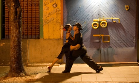 a couple perform the tango