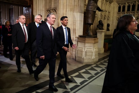 Rishi Sunak and Keir Starmer leaving the Commons chamber together to listen to the king’s speech in the House of Lords.