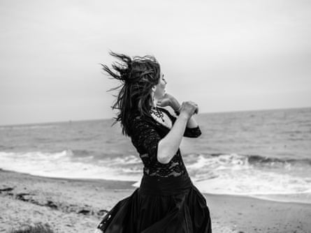 Bethany models a lace outfit on the beach