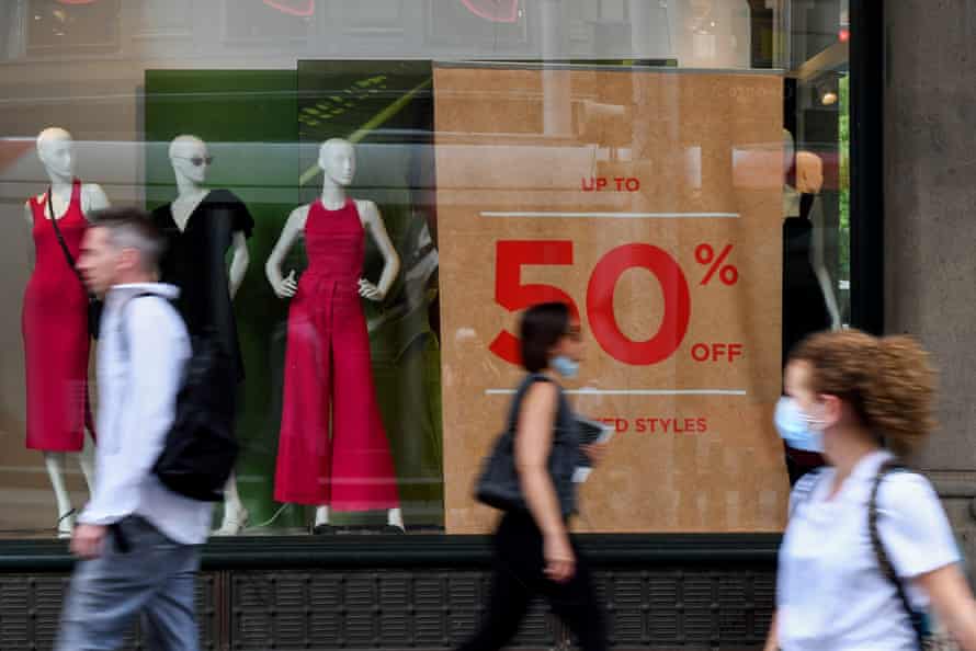 Pedestrians walk past a shopfront in Pitt Street mall in Sydney on Tuesday.