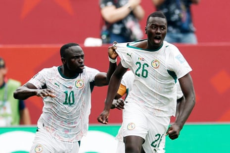 Senegal's Pape Gueye celebrates scoring their third goal with Sadio Mane.