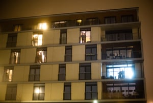 People clap and cheer on their balconies for the NHS and carers workers in Granton, Edinburgh