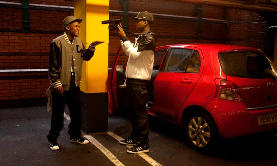YouTube hero: Jamal, above, filming a west London MC in a supermarket car park.