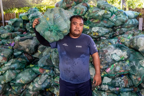 Putu Agus Indrawan holds up bags of plastic water bottles in a recycling centre. ‘With a population of 250 million, Indonesia is the fourth most populous country and second-largest plastic polluter in the world after China,’ according to the United Nations Environment Program
