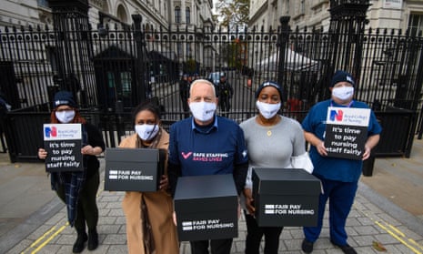 Graham Revie, chair of the RCN Trade Union Committee (centre), joins nurses at Downing Street, London to hand in the fair pay for nursing petition on 4 November
