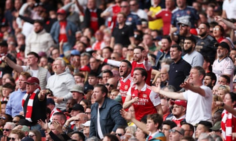 Arsenal fans react during their Premier League defeat against Brighton on 14 May 2023.