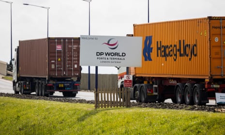 Trucks carrying shipping containers enter London Gateway port
