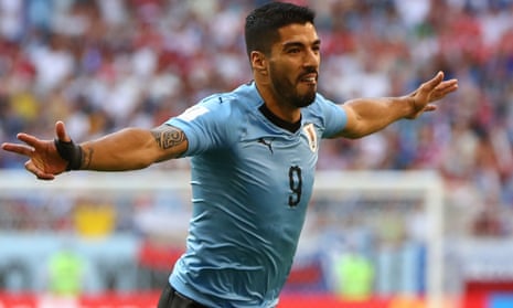 Luis Suárez celebrates putting Uruguay 1-0 up against Russia in their World Cup Group A match.