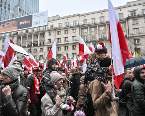 People take part in the Independence March in Warsaw, Poland.