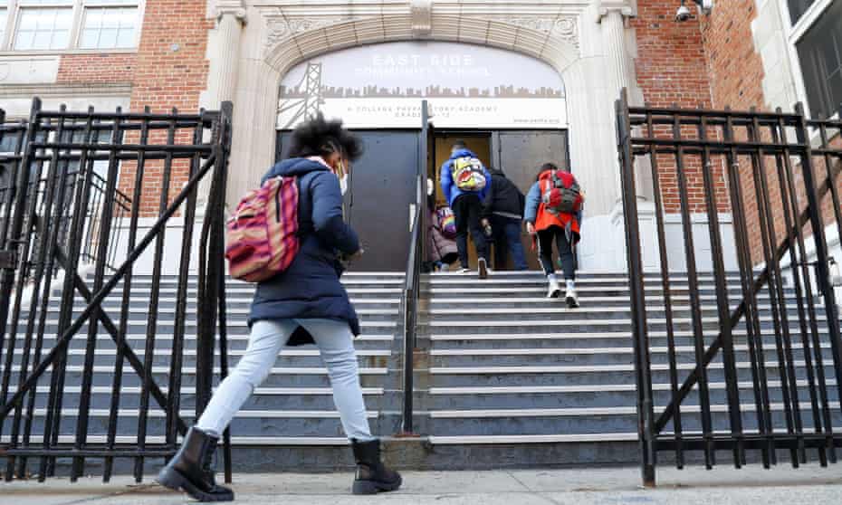 Students wear masks when they enter the East Side Community high school in New York’s East Village this month.