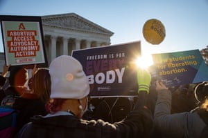 Opposing demonstrators gather outside the Supreme Court in Washington as arguments began in the high-profile Mississippi abortion case of Dobbs v Jackson.
