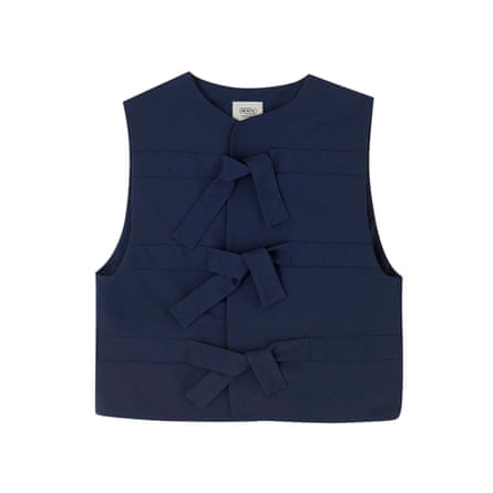 A navy sleeveless gilet with tie fastenings and quilted stitching, shown flat on a white background