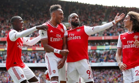 Arsenal’s Pierre-Emerick Aubameyang celebrates with teammates after scoring their second goal.