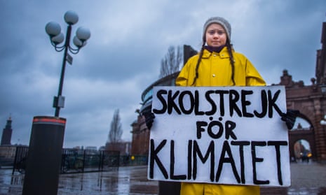 Greta Thunberg, 15, holds a placard reading ‘School strike for the climate’, during a protest outside the Swedish parliament in Stockholm last November. 