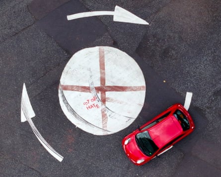The flag of St George painted on to a mini roundabout.