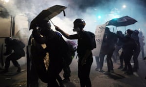 Protesters clash with local police and federal agents in Portland, Oregon, on 27 July.