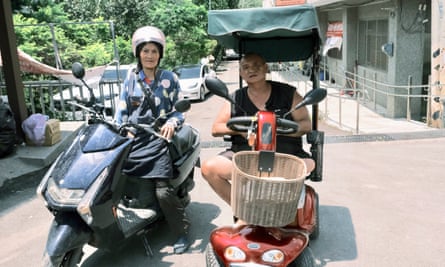 Wang Wan-quan, a 70-year-old farmer in Nang Feng village in his mobility scooter. “There is nothing to harvest,” he says.