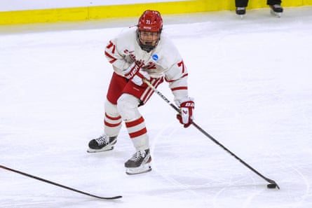 Boston University's Macklin Celebrini looks to pass the puck against Rochester during an NCAA men's college hockey tournament regional game in March.