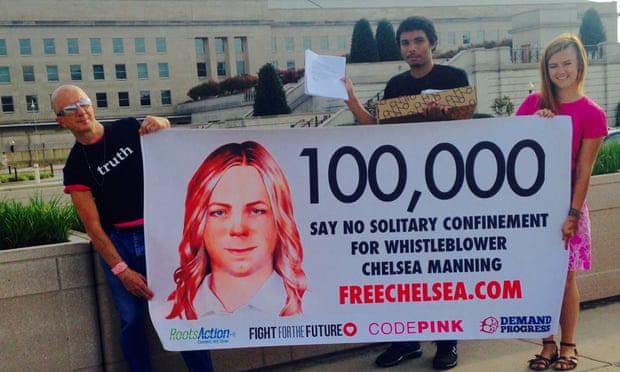 18 August 2015 Chelsea Manning supporters hold up banners near the Pentagon before delivering more than 100,000 signatures to the U.S. Army calling for new charges against whistleblower Chelsea Manning to be dropped.