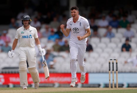 England's Matthew Fisher celebrates after taking the wicket of New Zealand's Daryl Mitchell.