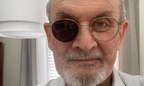 Salman Rushdie wearing glasses with one lens blacked out.
